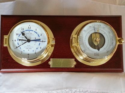 Brass time and tide clock and barometer